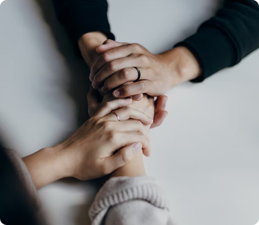 Two hands holding each other.